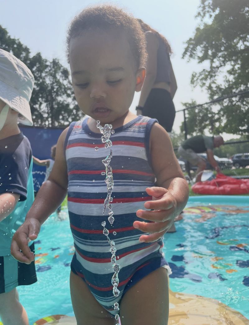 Summer water play in a splash pool.