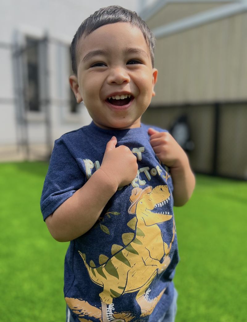 Big smiles out on the grass.